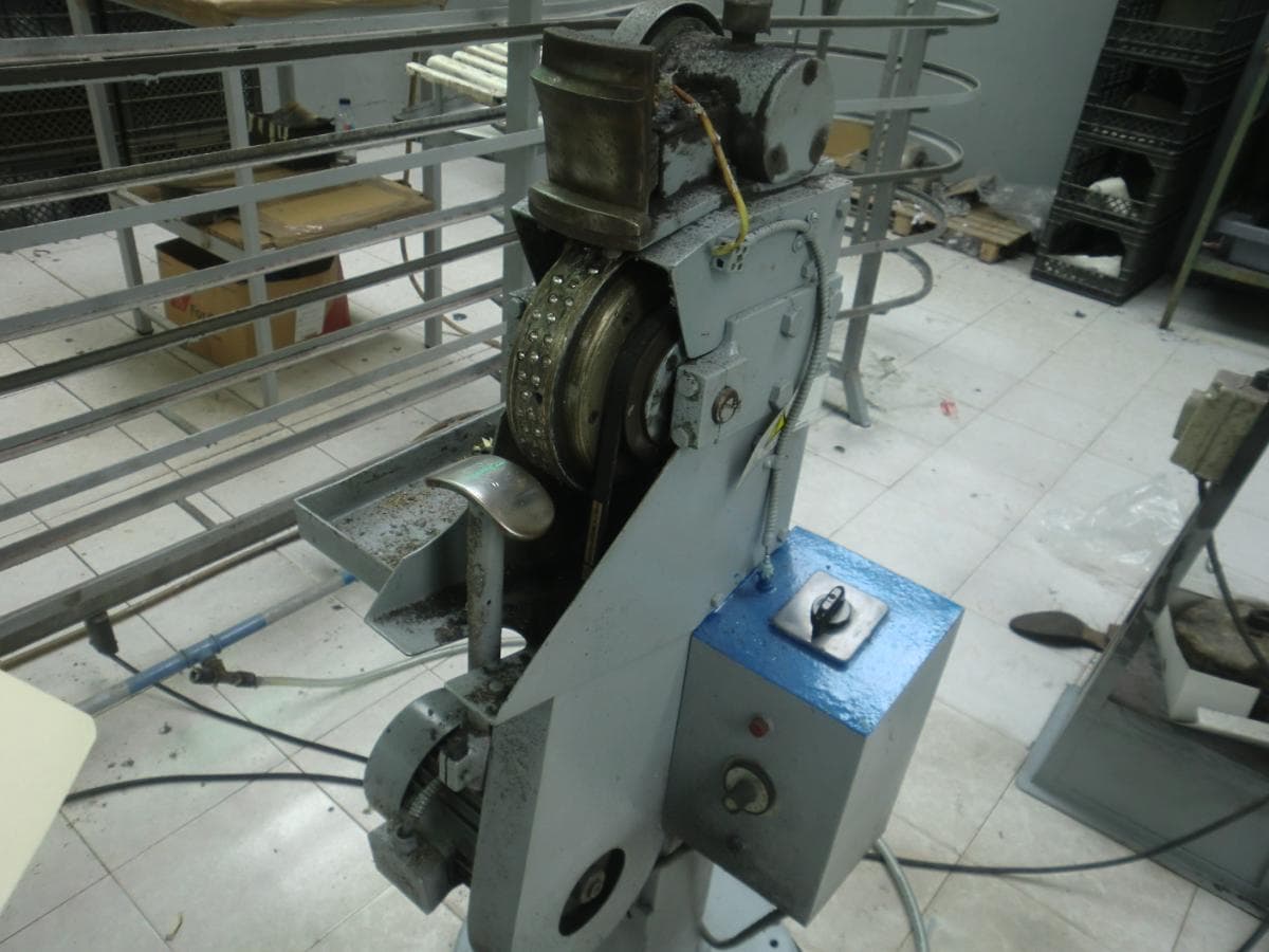 Máquina de rebater