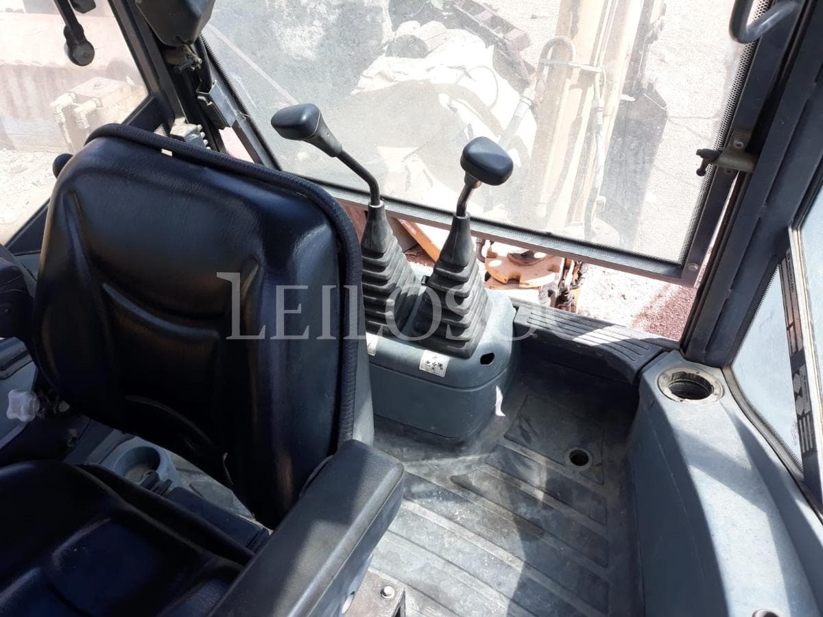 Rectro excavadora New Holland NH95 — imagem 14